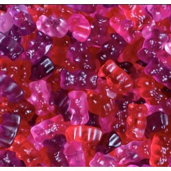 Vrac d'ours d'or Haribo de couleur rose, violet, et rouge.