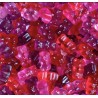 Vrac d'ours d'or Haribo de couleur rose, violet, et rouge.