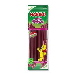 paquet de haribo balla stixx avec des lassos violet, et l'ours haribo appuyé sur deux lassos
