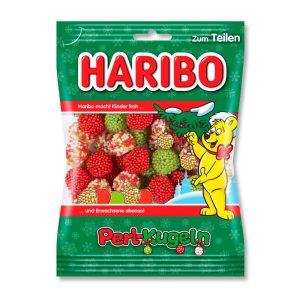 sachet de bonbon haribo avec l'ours haribo avec des bonbons rond et des petites billes de couleurs rouge vert et blanc