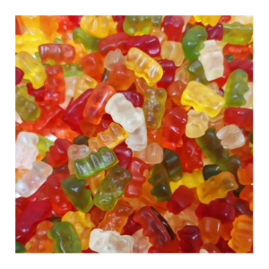 Vrac d'ours d'or multicolores de chez Haribo, blanc, rouge, orange, jaune, vert.