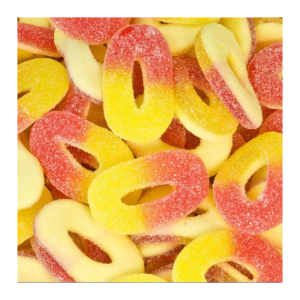 Vrac de rondelles pêche qui sont des bonbons gélifiés et sucrés en forme de rondelles au goût de pêche