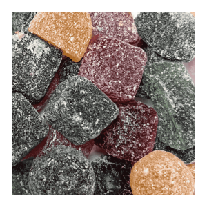 Vrac de gom's qui sont des bonbons gommes d'acacia vert, rouge, orange