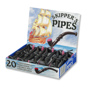 Pipe en réglisse avec des petites billes en sucre rose au bout