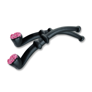 Pipe en réglisse avec des petites billes en sucre rose au bout