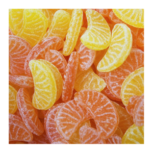 vrac de tranches orange et citron qui sont des bonbons au sucre cuit de chez Kubli